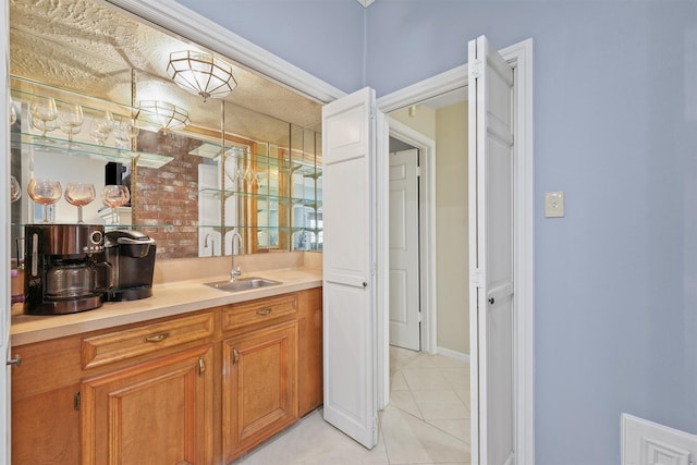 bathroom with tile patterned flooring and vanity