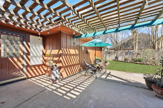 view of patio / terrace with fence and a pergola