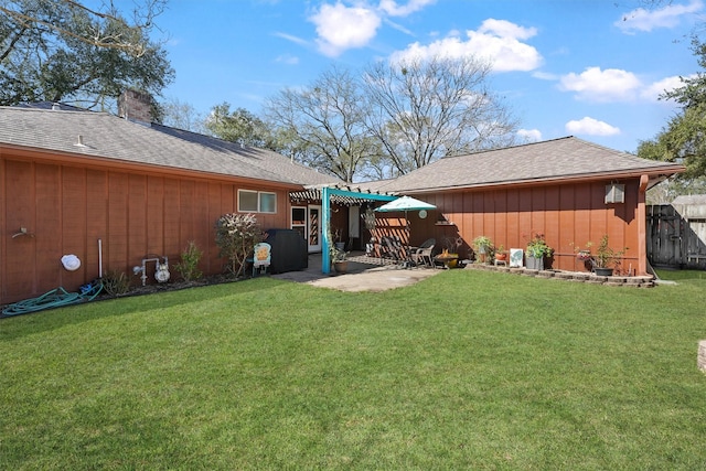 view of yard featuring a patio, fence, and a pergola