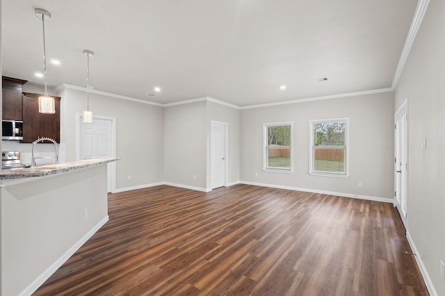 unfurnished living room with ornamental molding, dark wood-style flooring, recessed lighting, and baseboards