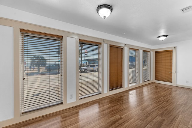 interior space featuring visible vents and wood finished floors