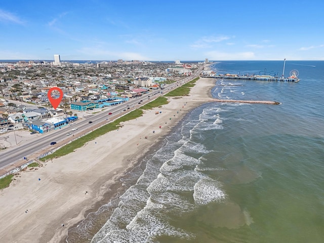 aerial view featuring a water view and a view of the beach