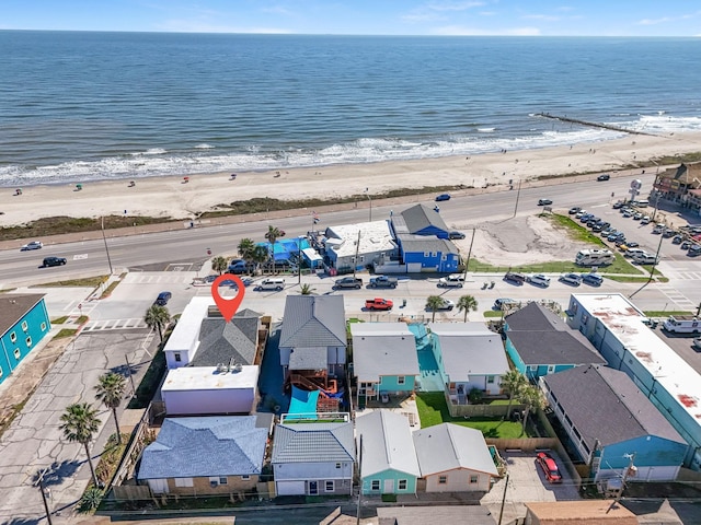 bird's eye view with a view of the beach, a water view, and a residential view