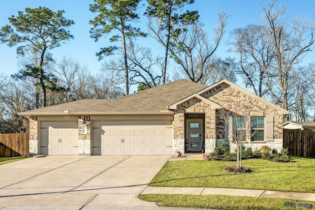 view of front of property featuring a garage, fence, concrete driveway, stone siding, and a front lawn