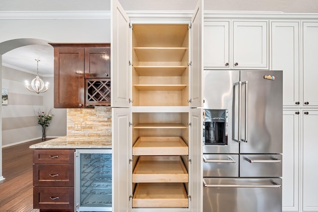 storage area featuring wine cooler