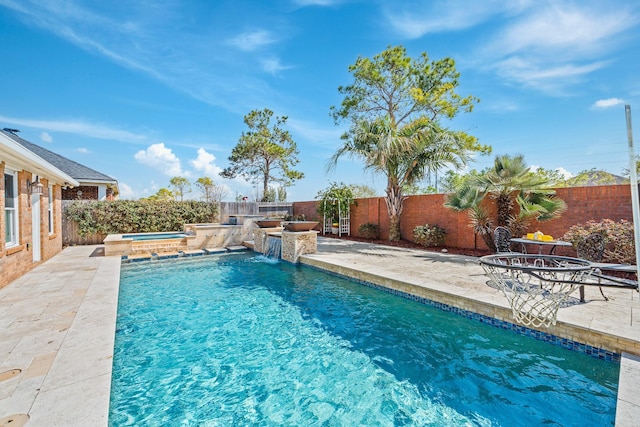 view of swimming pool featuring a fenced in pool, a fenced backyard, a jacuzzi, and a patio area