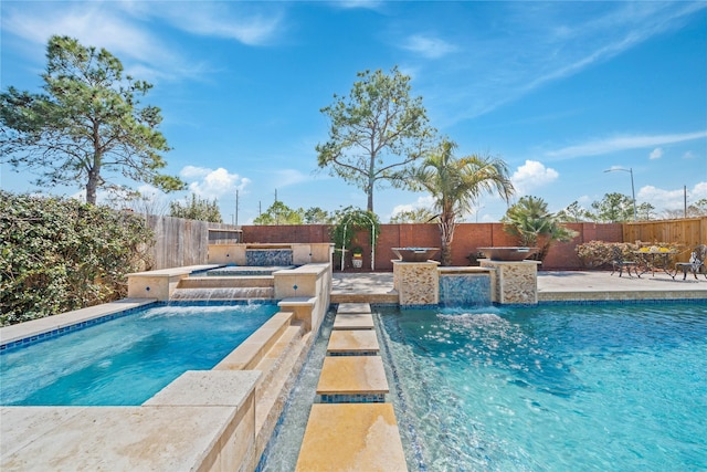 view of pool with a fenced in pool, a patio, a hot tub, and a fenced backyard