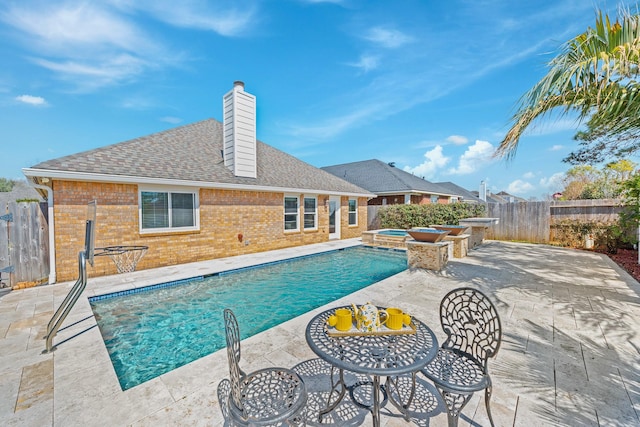 view of swimming pool featuring a fenced in pool, a patio, an in ground hot tub, and a fenced backyard