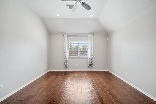 unfurnished room featuring a ceiling fan, baseboards, visible vents, lofted ceiling, and hardwood / wood-style flooring