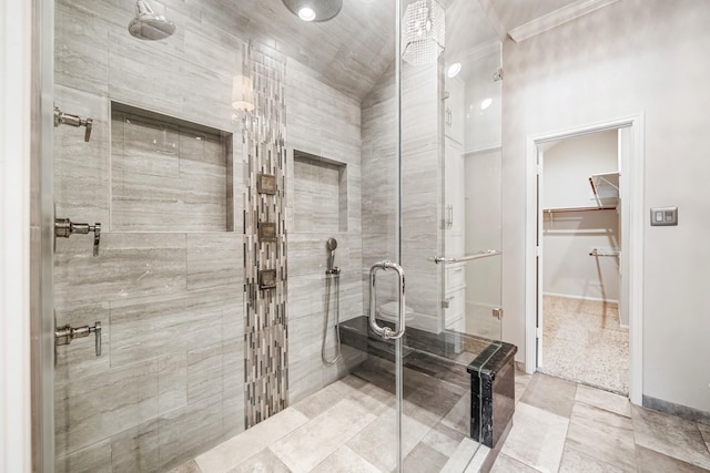 full bathroom with a stall shower, baseboards, and ornamental molding