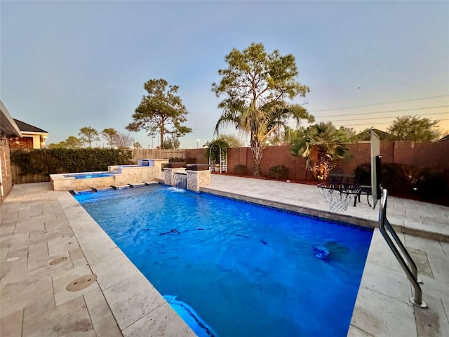 view of swimming pool with an in ground hot tub, a fenced backyard, a fenced in pool, and a patio