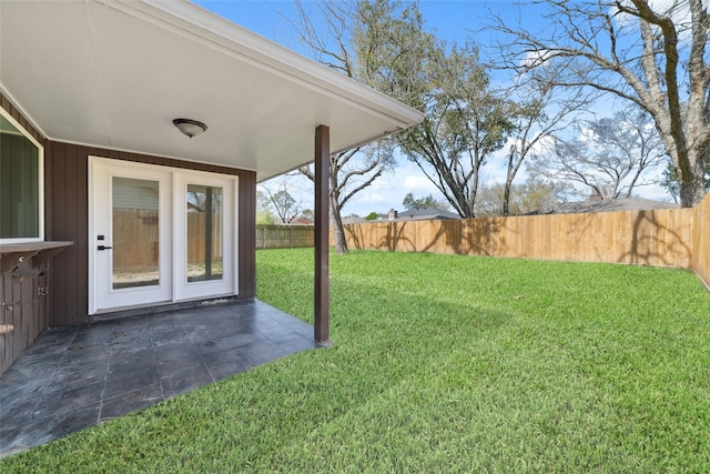 view of yard with a patio and a fenced backyard