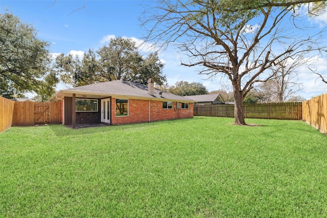 view of yard featuring a fenced backyard