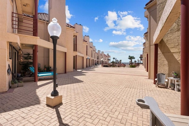 view of home's community featuring a patio area