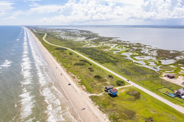 drone / aerial view with a view of the beach and a water view