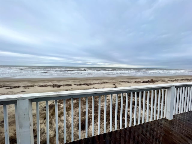 exterior space featuring a water view and a view of the beach