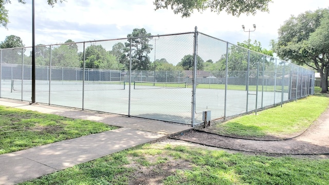 view of tennis court with fence