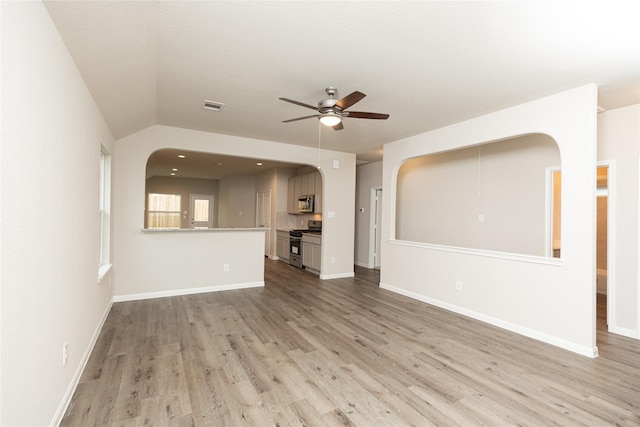 unfurnished living room featuring ceiling fan, light wood-type flooring, visible vents, and baseboards