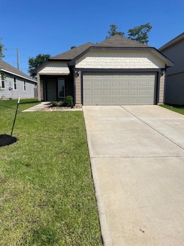 14041 Lamprey Dr, Conroe, TX 77384 - ranch-style house with an attached garage, concrete driveway, and a front yard
