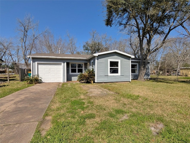 view of front facade with a garage, driveway, a front yard, and fence