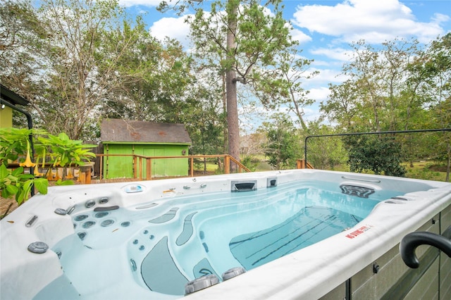 view of pool featuring a hot tub