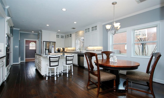 dining space with recessed lighting, a notable chandelier, dark wood-type flooring, baseboards, and crown molding