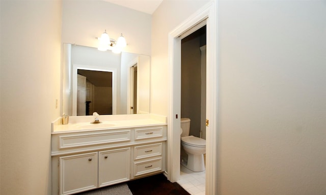 bathroom featuring vanity and toilet