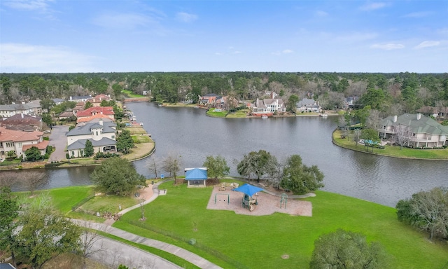 drone / aerial view with a water view and a residential view