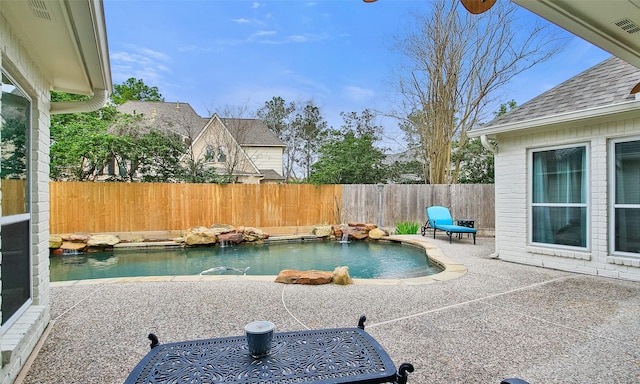 view of pool with a fenced in pool, a patio area, and a fenced backyard