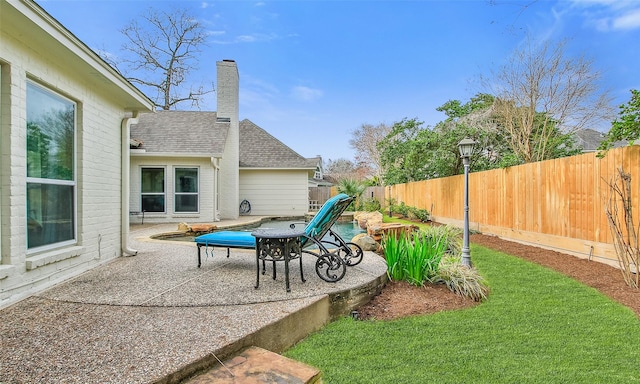 view of patio with a fenced backyard