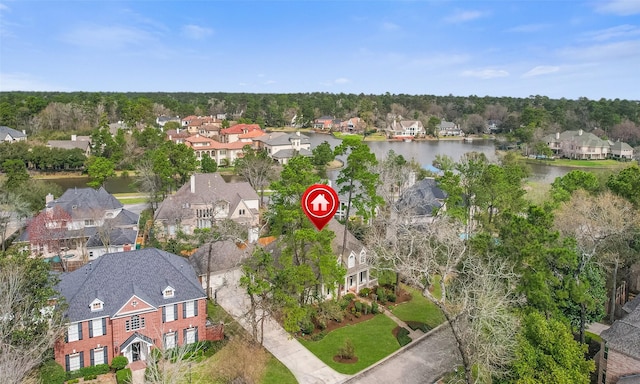 drone / aerial view with a residential view and a water view