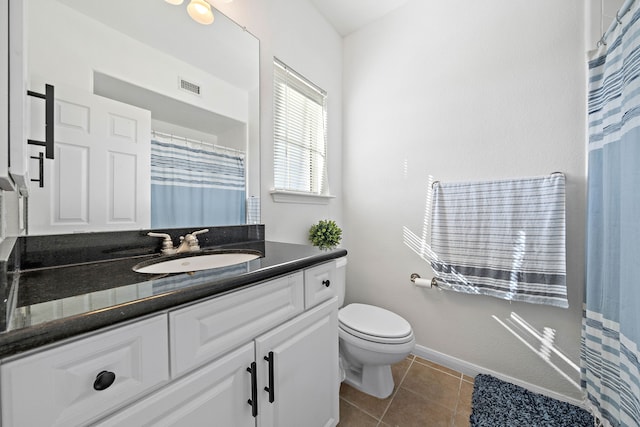 full bath with baseboards, visible vents, toilet, tile patterned floors, and vanity