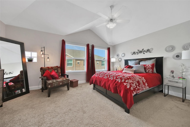 carpeted bedroom with vaulted ceiling, a ceiling fan, and baseboards