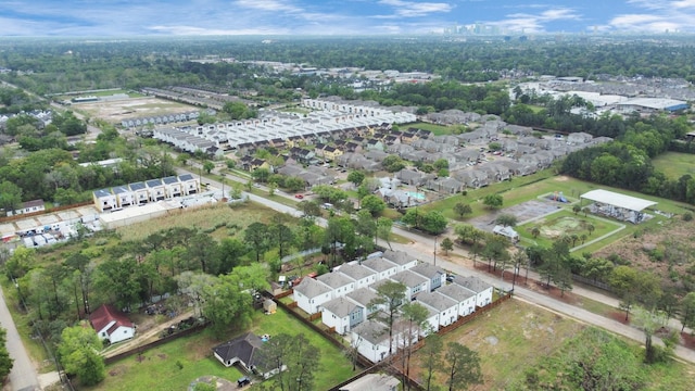 birds eye view of property with a residential view