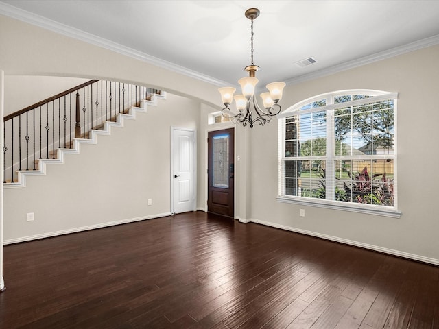 foyer with stairs, visible vents, dark wood finished floors, and crown molding