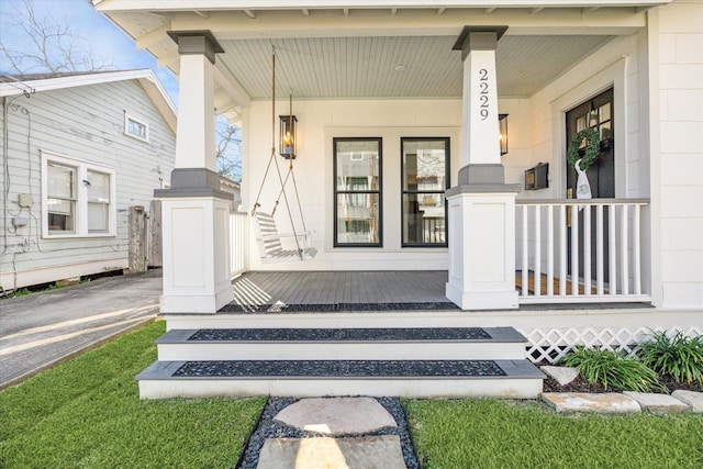 entrance to property featuring covered porch