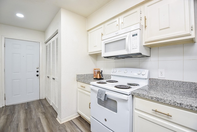 kitchen with white appliances, baseboards, dark wood-style flooring, light stone countertops, and white cabinetry