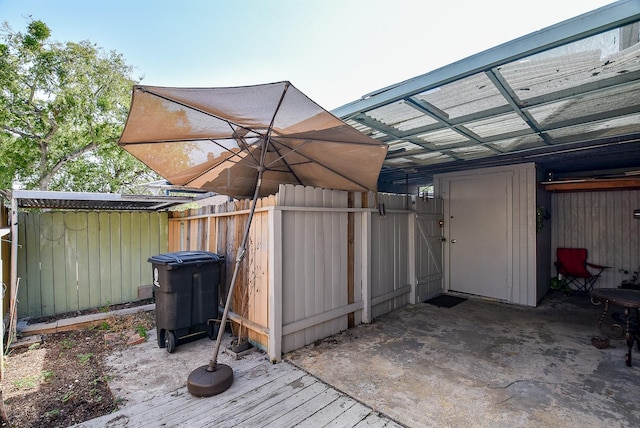 view of outbuilding with fence