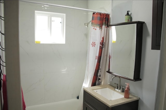 full bathroom featuring vanity and shower / bathtub combination with curtain