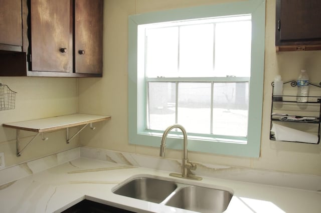 kitchen with light countertops and a sink