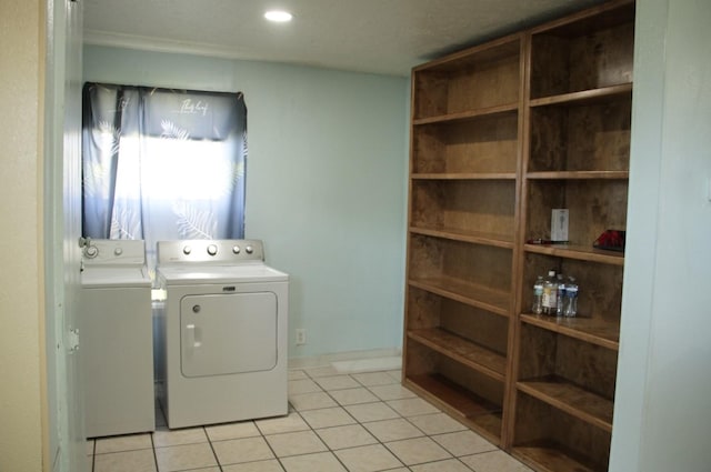 laundry area with light tile patterned floors, laundry area, and independent washer and dryer