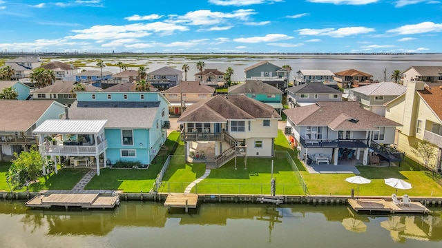 bird's eye view featuring a water view and a residential view