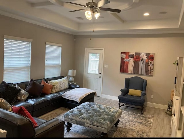 living area featuring visible vents, ceiling fan, light wood-style flooring, and baseboards