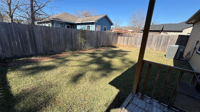 view of yard with cooling unit and a fenced backyard