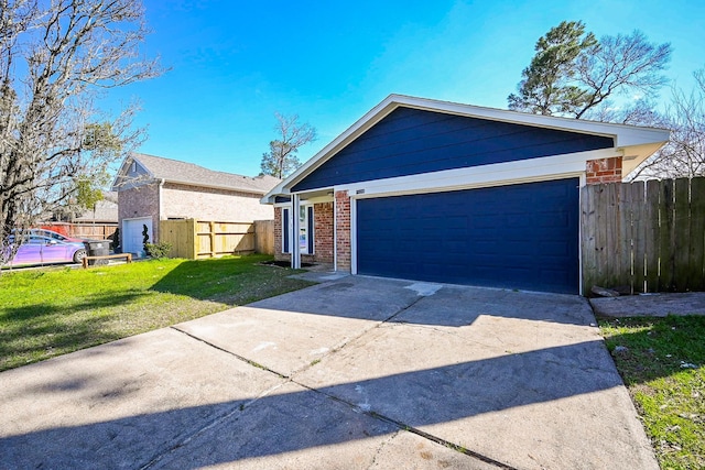 ranch-style home with brick siding, an attached garage, a front yard, fence, and driveway