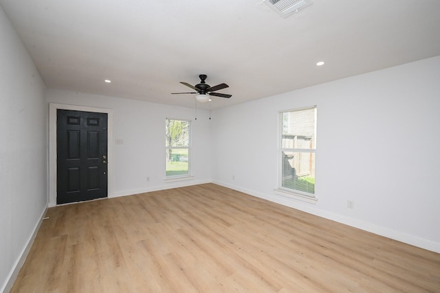 empty room with light wood finished floors, baseboards, visible vents, a ceiling fan, and recessed lighting