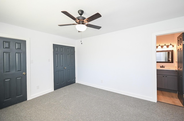unfurnished bedroom with carpet floors, a closet, and baseboards