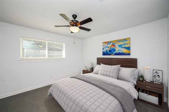 bedroom with a ceiling fan and baseboards