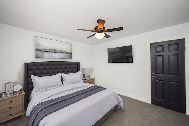 carpeted bedroom with a ceiling fan and baseboards