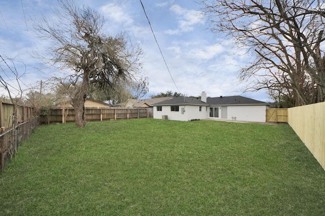 view of yard with a fenced backyard